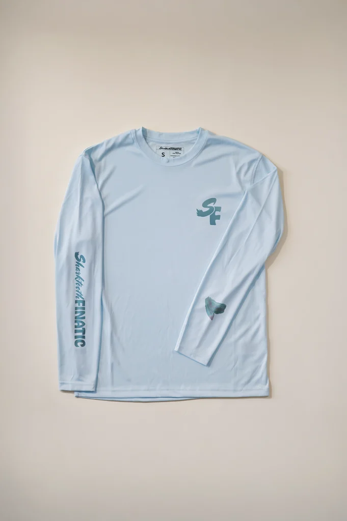ice blue long-sleeve performance shirt with tiger shark tooth design